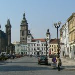 Old Town square with arcade shops and apartments.