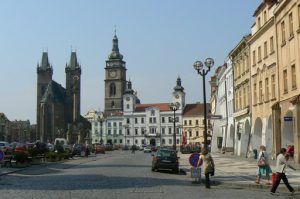 Old Town square with arcade shops and apartments.