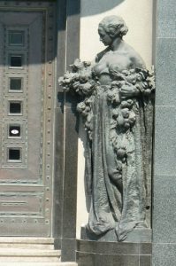 Detail of art deco entry statuary to a bank in