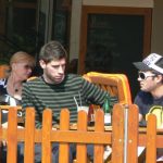 Friends linger over refreshments in a cafe.