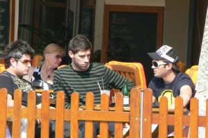 Friends linger over refreshments in a cafe.