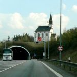 Unusual juxtaposition of a church and a highway tunnel.
