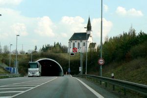 Unusual juxtaposition of a church and a highway tunnel.