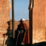 Merzouga man in arch.