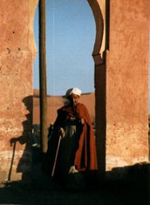 Merzouga man in arch.