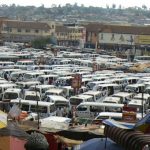 Taxi vans crammed into the taxi terminal. Vans are often loaded