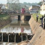 Polluted waterway near center of town