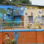 Colorful (private) schoolyard. Private schools are big business in Uganda.