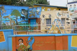 Colorful (private) schoolyard. Private schools are big business in Uganda.