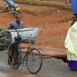 Masindi bale of charcoal being biked to market