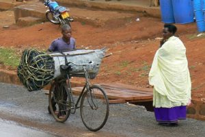 Masindi bale of charcoal being biked to market