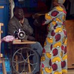 Masindi taylor and colorful friend; women often dress in bright