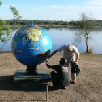 Murchison Falls National Park visitors inspecting globe by the River