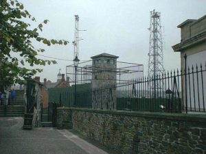 Security fencing around remaining British (Protestant) police station tower; most