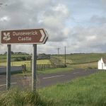 North Coast road with castle sign