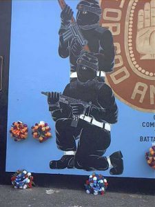 West Belfast - Loyalist (British) mural of masked paramilitary guerrillas