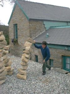 Playing with rock sculpture
