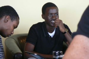 Student in trendy wi-fi cafe in Kigali