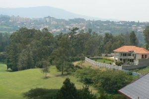 Upscale mansions surround a golf course in Kigali.