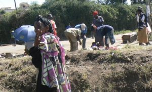 Waiting and walking to collect donated food supplies.