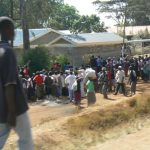 Kibera residents walking to food distribution centers after the riots