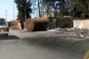 Burned debris along the main road.