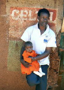 A young father holds his baby. Family planning is difficult