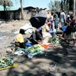 Meager offerings amid the ruins of the burned market