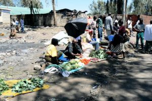 Meager offerings amid the ruins of the burned market