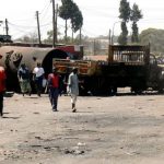 Burned out truck and disarray from riots