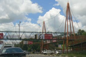 Elevated walkway over a busy intersection near the malls.