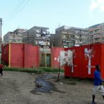 Methare high-rise residential blocks with sewage seeping out. The red boxes
