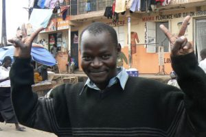 A smiling resident of Methare displays his resilience and hope