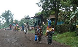 Busy village road in Marangu with colorfully clothed women.