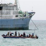 Stering boat on water