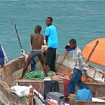 Fishermen coming into port.