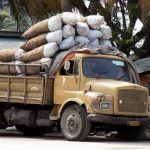 Loading and unloading (sacks of charcoal?) is done by hand.