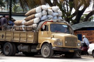 Loading and unloading (sacks of charcoal?) is done by hand.