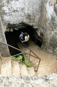 Exploring a cave in the extensive volcanic rocks on the