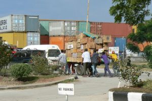 Local goods are carried off by foot power.