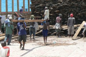 Stone Town port: unloading a shipload of hardwood lumber by