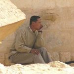 Man sitting at the ancient Temple of Ammon (Amun) where Alexander