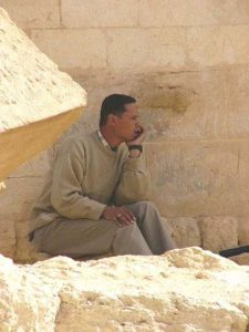 Man sitting at the ancient Temple of Ammon (Amun) where Alexander