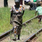 Train from Tanzania to Zambia - Woman & children walking