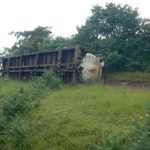 Overturned rail car left by the side; we passed several