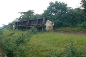 Overturned rail car left by the side; we passed several