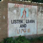 Posters painted on a wall outside