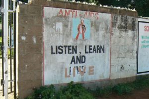 Posters painted on a wall outside