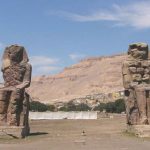 The Colossi of Memnon are two massive stone statues of