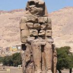 The Colossi of Memnon are two massive stone statues of